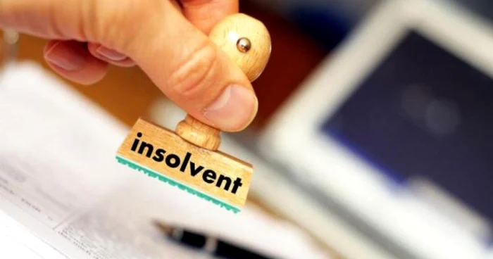 Someone puts the insolvent stamp on a document