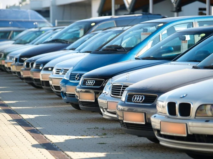 SH cars in a parking lot