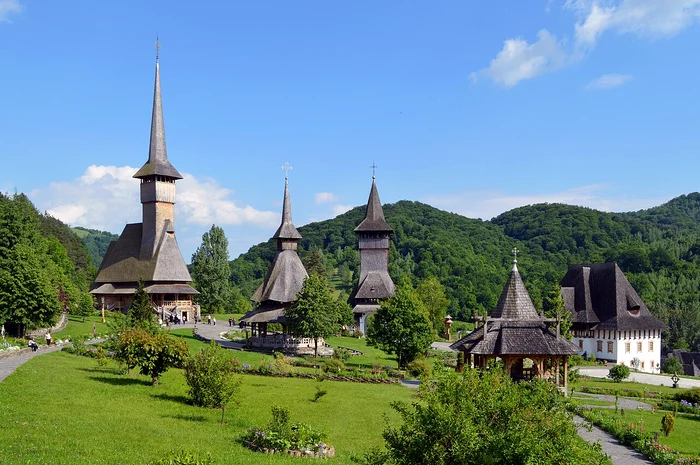 A monastic complex from Maramures and wooden church between wooded hills