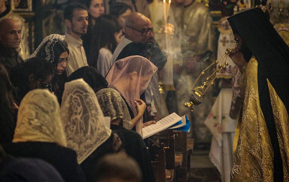 Faithful during the Deny Mass in the Greek Orthodox Church of St. Porfiriosa in the city of Gaza