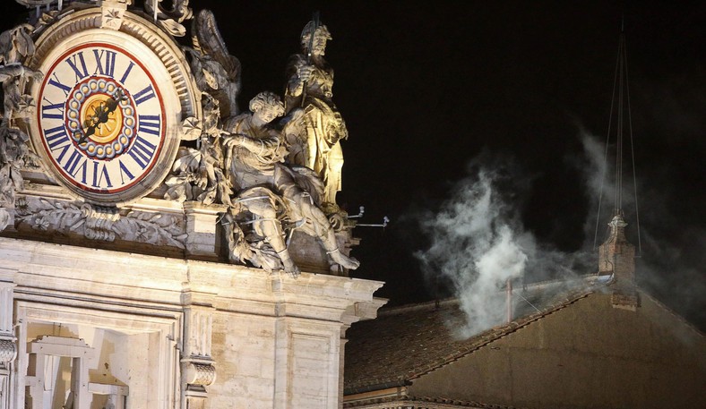 White smoke rises from the chimney on the roof of the Sistine Chapel. Vatican, March 13, 2013