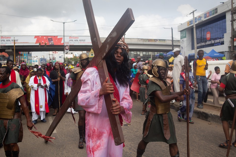 Members of the church of St. Leon take part in the procession of the Way of the Cross on Good Friday in Ikeja, Lagos in Nigeria