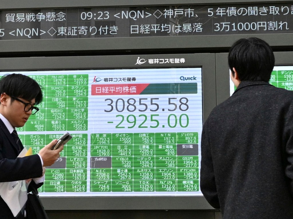 A Tokyo display displays the decreases recorded by Nikkei Stock