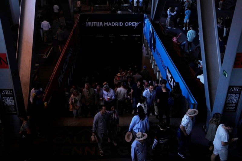 Spectators inside the location where the Tennis Tournament Madrid Open took place, during the power out