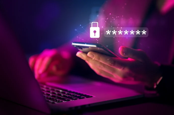 Someone copies a password on the phone on a laptop