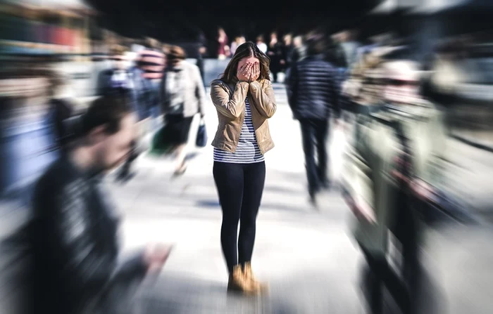 A woman in a crowd who has a Panic Photo Source Attack St Patrick S Mental Health Services