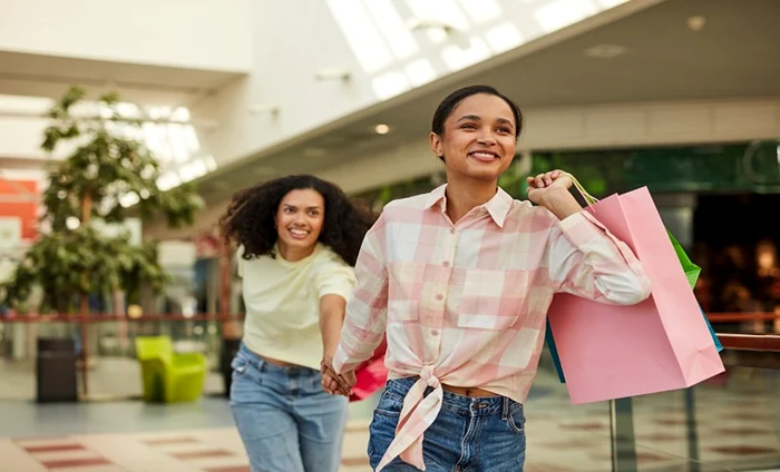 Two young people in a mall at a shopping session in alert European Medical Journal photo