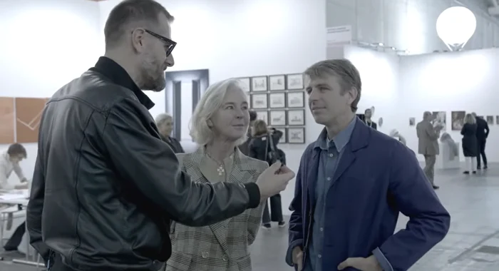 Alessandro Possati (right) at an art exhibition. Photo: YouTube video capture