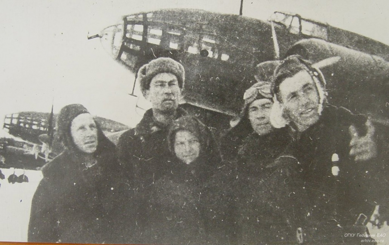 Chairman of the collective farm Labor Niva E. I. Simonov and Fronts pilots near aircraft built at the expense raised by workers of the EAO