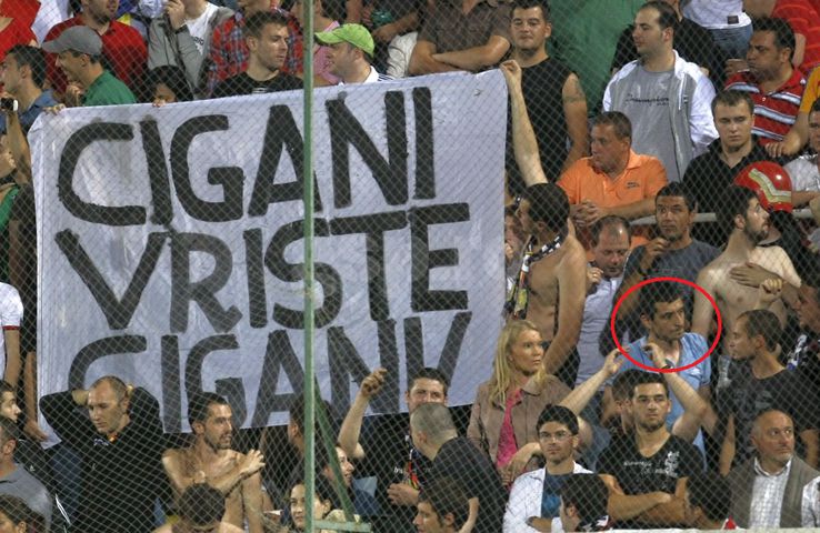 George Simion in Romania - Bosnia, in 2011. Near him, a racist message directed to Bosnian: 