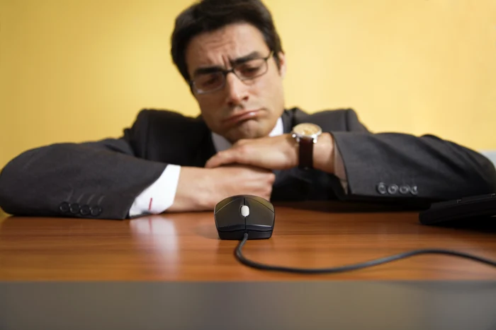 An employee looked up angrily at the mouse