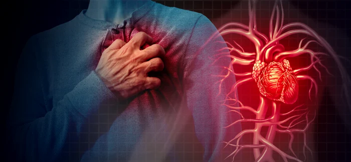 Person holding the chest in the heart area, classic sign of a possible heart attack uk