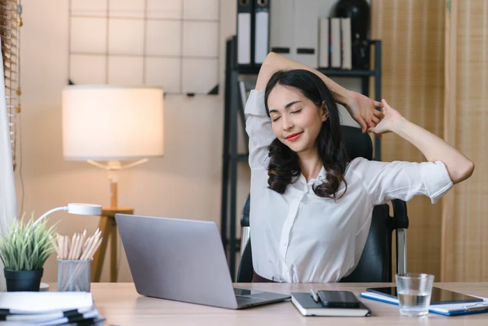 Woman enjoying an exercise in the World Class photo office