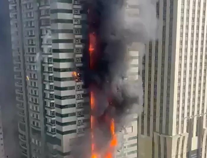 Tower block, contained by photo flames: x