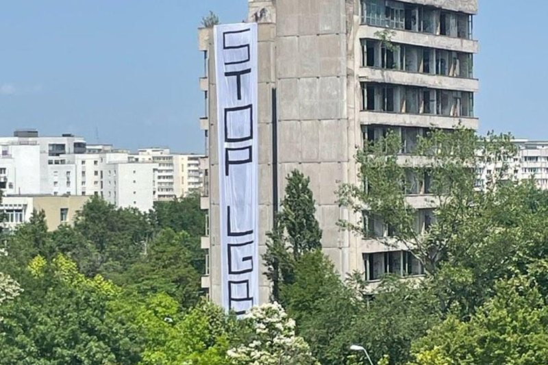 Banner with homophobic message, displayed on an abandoned block in Bucharest.