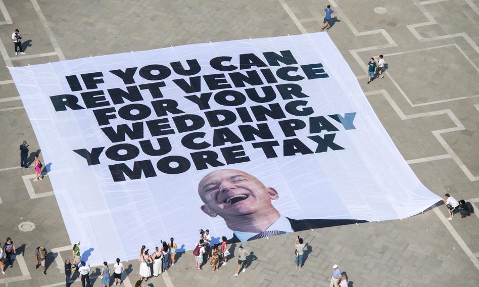 Greenpeace great banner. "If you can rent a Venice for a wedding, you can pay more taxes"