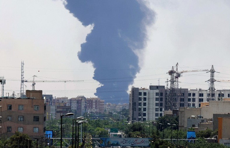 Smoke from oil refinery over residential buildings in the southern part of Tehran, Iran, June 15, 2025.