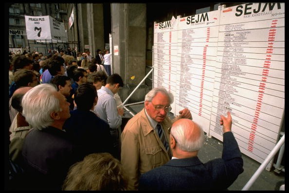 Discussions in front of the results board