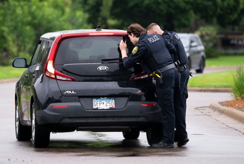 Policemen check the car entering the district on June 14, 2025 in Brooklyn Park, Minnesota, USA, June 14, 2025.