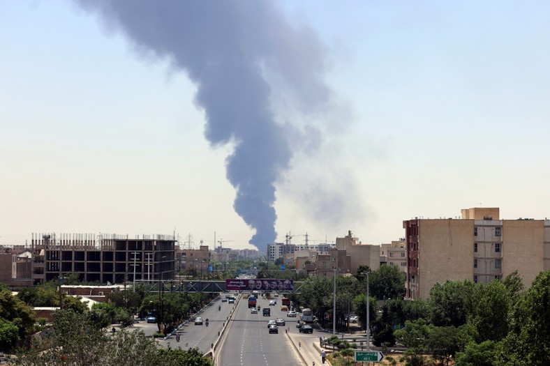 Smoke from oil refinery over residential buildings in the southern part of Tehran after Israel's attacks, Iran, June 15, 2020.