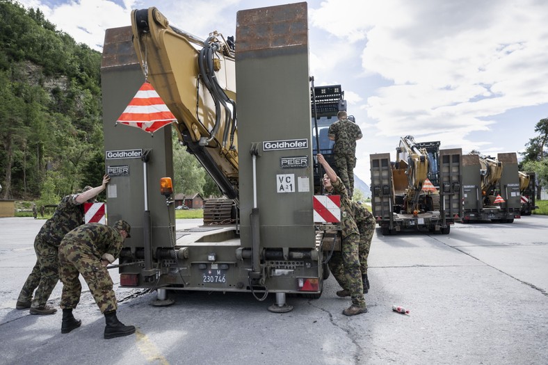 Soldiers of the Military Emergency Service of the Swiss army prepare heavy equipment to help at the crash site in Blatten, at the Military base in Turtmann, Switzerland, on May 29, 2025.