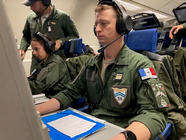 Major Benoit supervising supervision operations on the AWACS aircraft