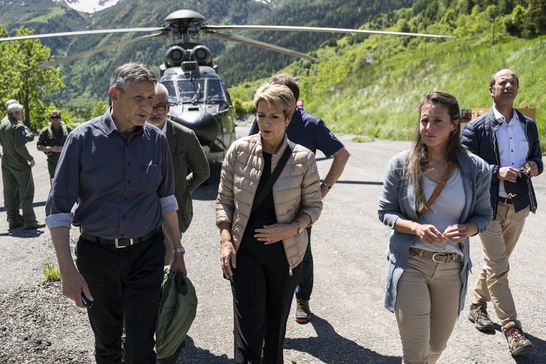 The President of Switzerland Karin Keller-Sutter (SK), Mayor of the Blatten commune (L) Matthias Bellwald and a member of the Government of Canton Valais Franziska Biner after seeing the damage caused by the landslide, which destroyed the village of Blatten in Switzerland, May 30, 2025.