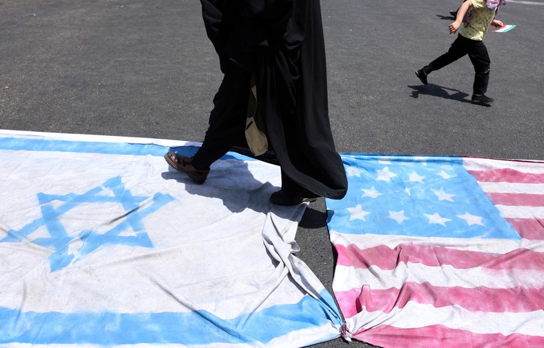 The Iranians are trampling Israeli and American flags during the anti -Irish manifestation in Tehran, Iran, June 20, 2025.