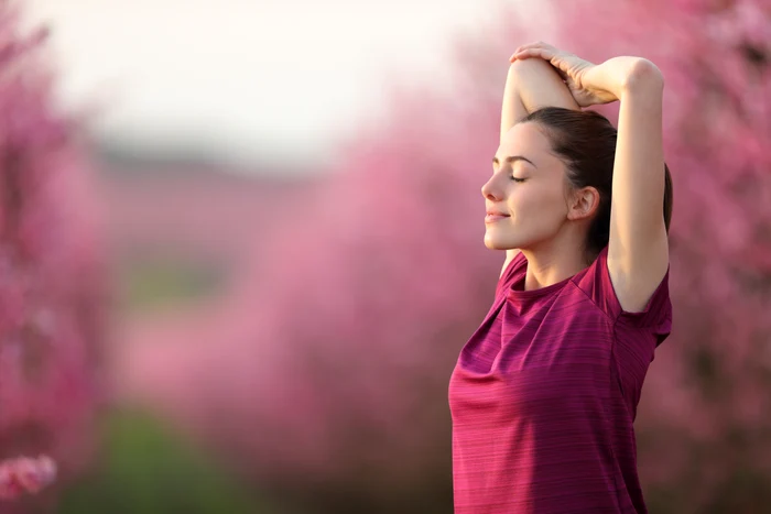 woman dressed in purple, meditating