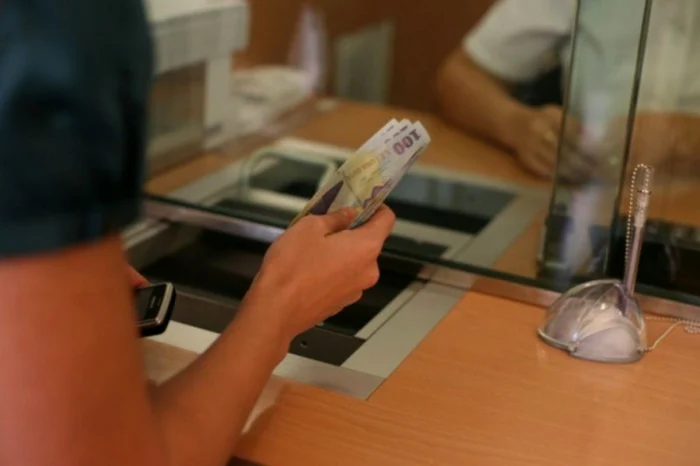 Someone pays the rate at the banking counter