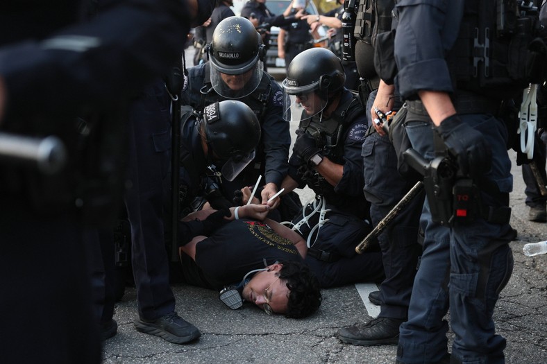 Police with detained protesters against the aggressive policy of Donald Trump regarding migration, Los Angeles, California, USA, June 9, 2025.