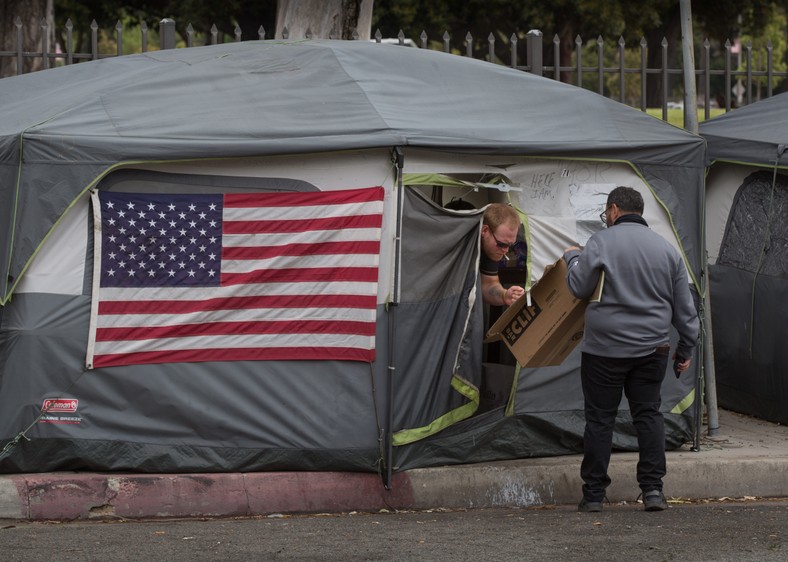 A homeless American veteran leaves his tent (illustrative photos)