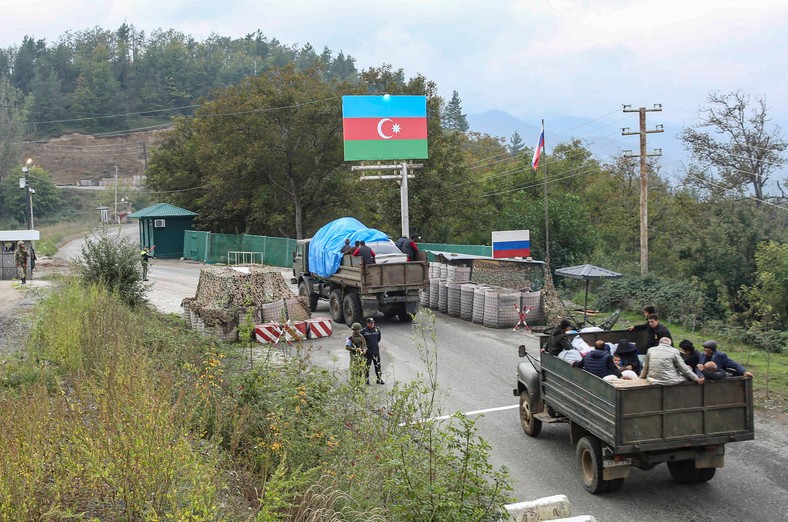 People of Armenian origin escape from Karabakh to Armenia in trucks through the passage controlled by Russian soldiers of peace forces and Azeri border guards, September 26, 2023.