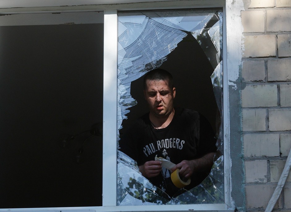 A resident of Kiev repairing the window after a Russian attack, on July 4, 2025.