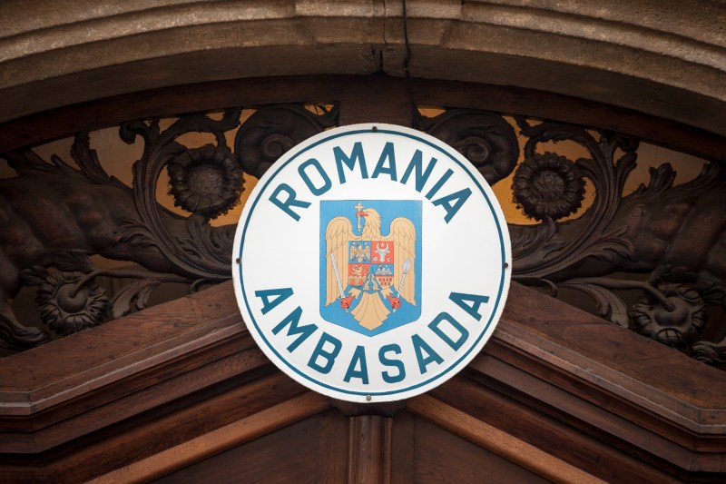 What business opportunities promote Romania's embassies on their websites: hair implant or intestinal worms treatments