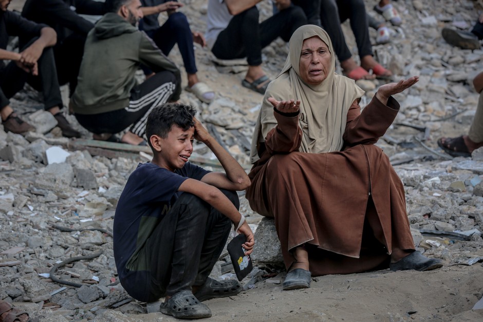 Palestinians in the Gaza Zone mourn relatives killed in the Israeli bombing, on July 26, 2025.