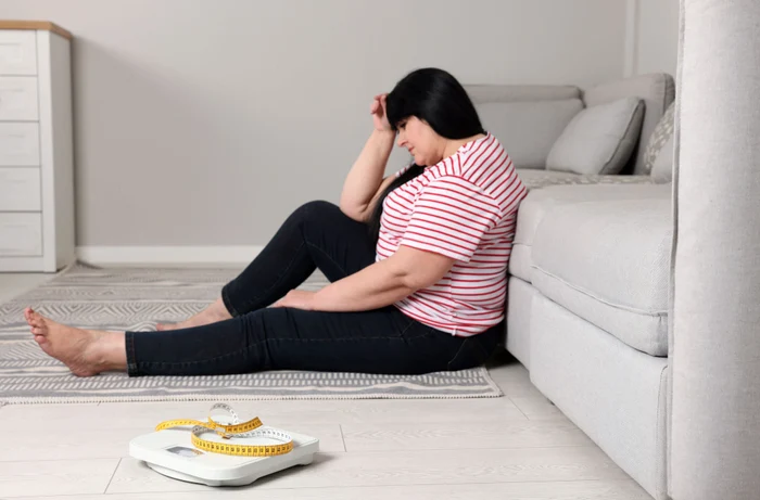 A woman in depression because of body weight shutterstock