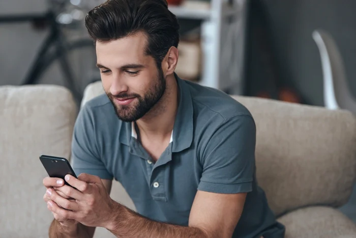 man with phone in hand