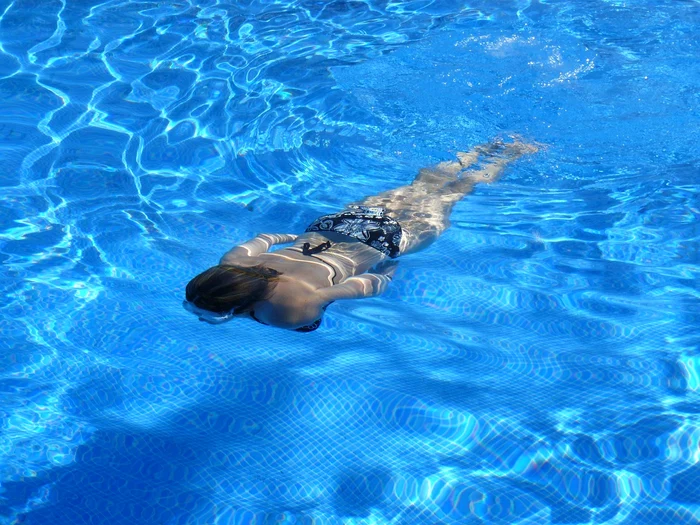 Swimming girl in a pool