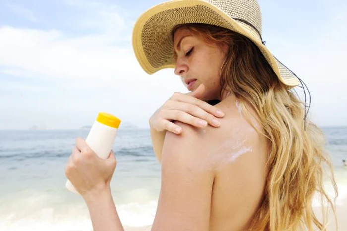SPF cream, mandatory at the archive photo beach