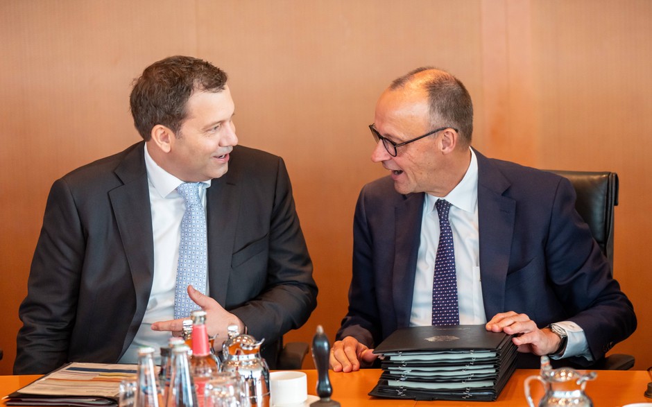 German Chancellor Friedrich Merz talks with the German finance minister Lars Klingbeil, Berlin, 6 August 2025.