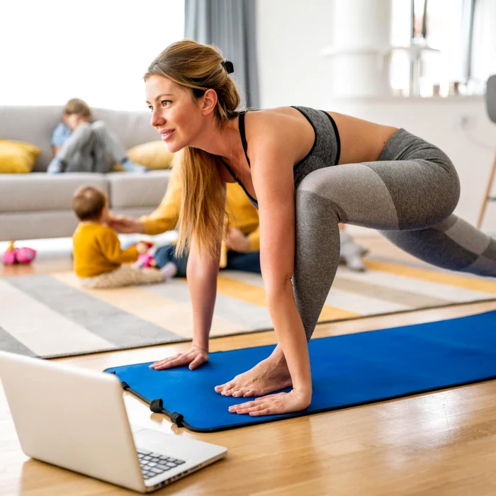 Woman doing Digital Fitness Home, near the Family Photo Shutterstock