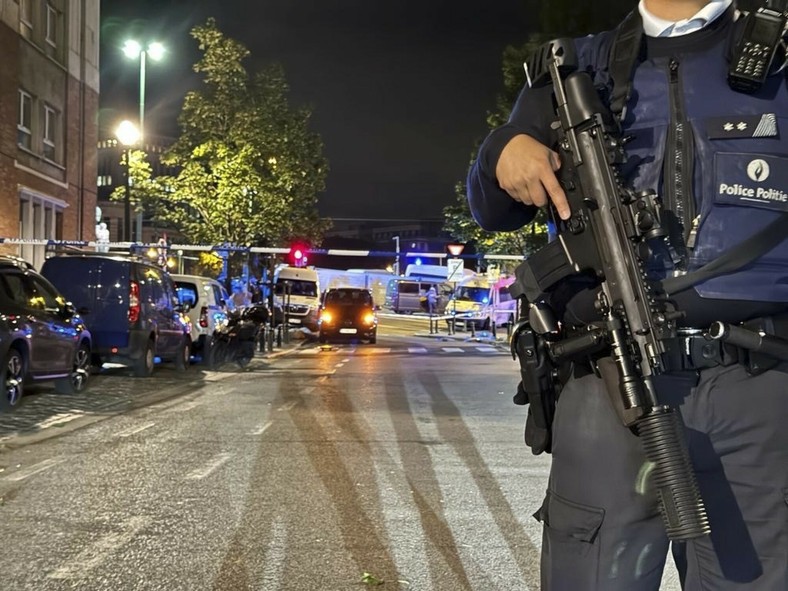 Policeman at the site of the shooting in Brussels (illustrative photos)