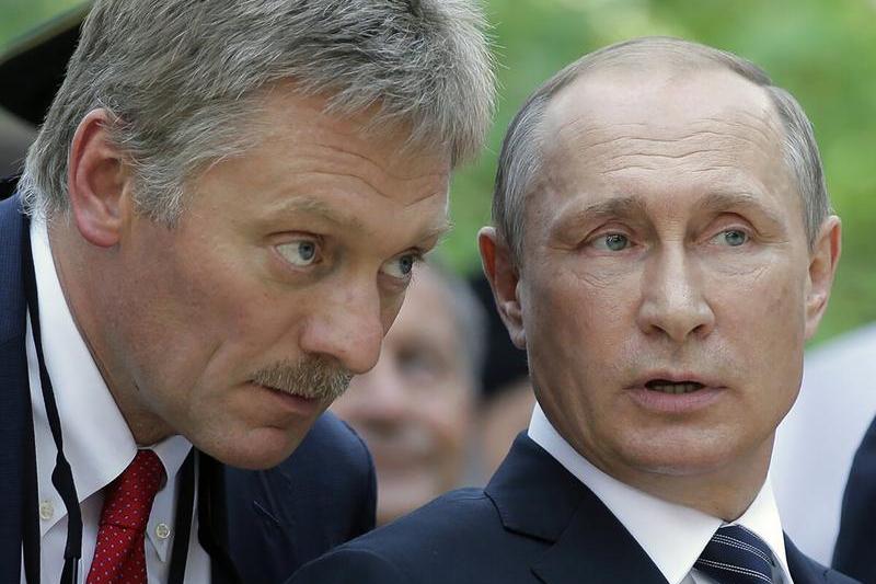 Dmitri Peskov with Vladimir Putin, photo: Willwest News / Profimedia Images