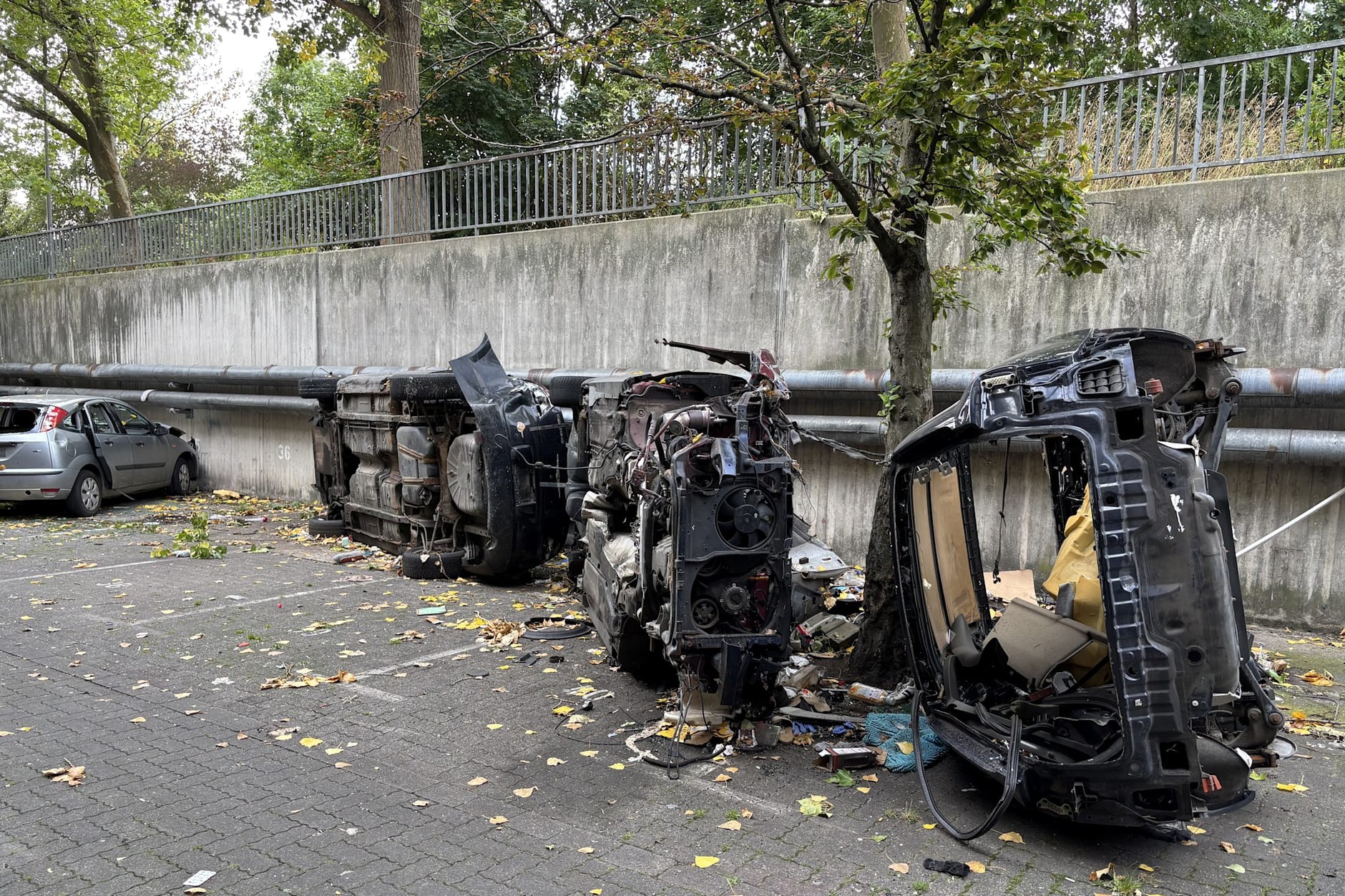 Destroyed cars in the courtyard