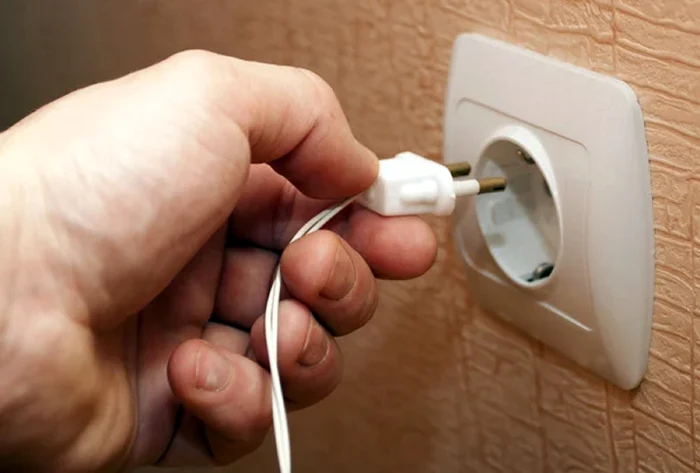 Someone puts a plug in the socket