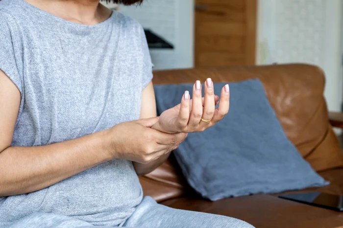 A woman with articular problems Sign of rheumatoid arthritis photo shutterstock