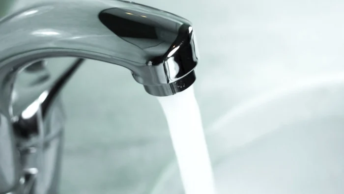 The water flowing to the tap