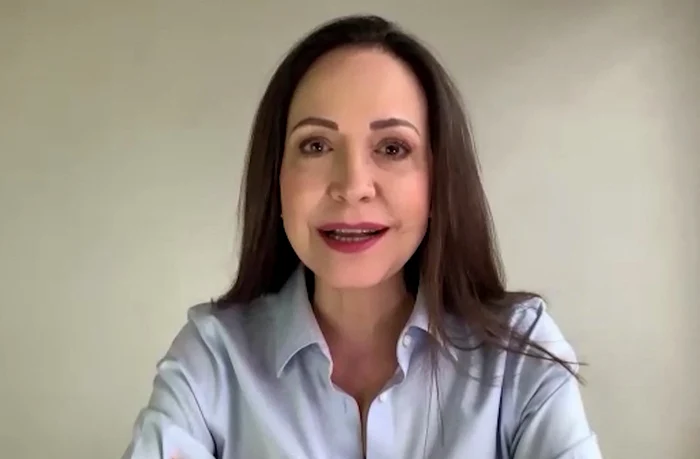 Corina Machado announces that she is returning to Venezuela. PHOTO: AFP