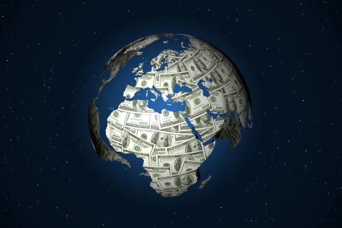 The earth globe over whose continents are put on dollars, suggesting the global debt